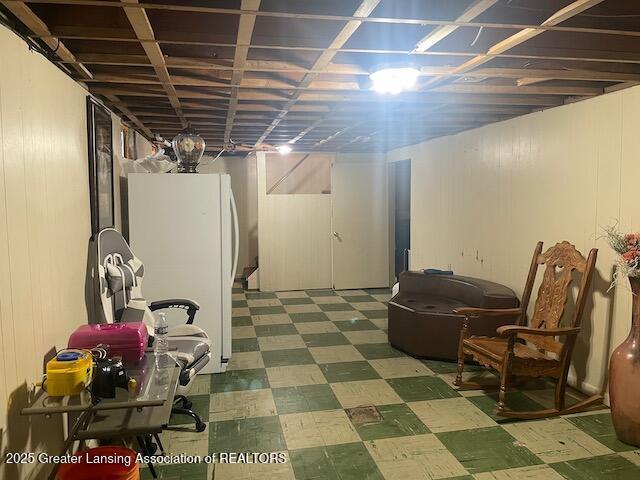 6422 E Saginaw Hwy, Grand Ledge, MI 48837 - finished basement featuring tile patterned floors and freestanding refrigerator