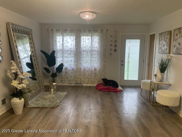 6422 E Saginaw Hwy, Grand Ledge, MI 48837 - foyer entrance featuring wood finished floors and baseboards