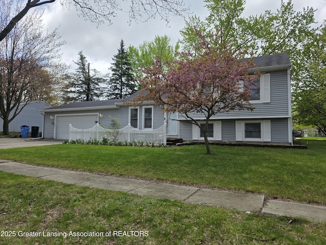 tri-level home with a garage and driveway