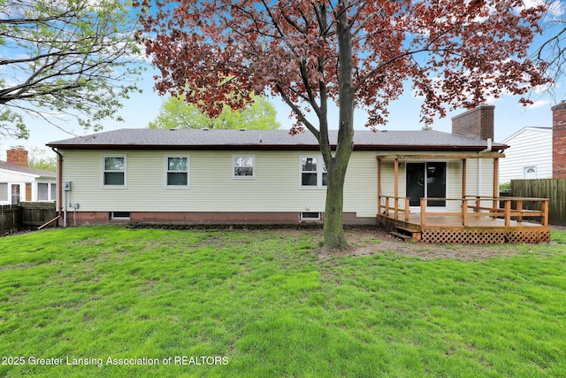910 Pecos Dr, Lansing, MI 48917 - back of house featuring a deck and a chimney