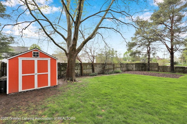 910 Pecos Dr, Lansing, MI 48917 - view of yard with a storage unit and an outdoor structure
