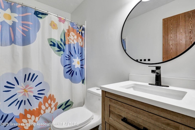 910 Pecos Dr, Lansing, MI 48917 - full bath with vanity, toilet, and curtained shower