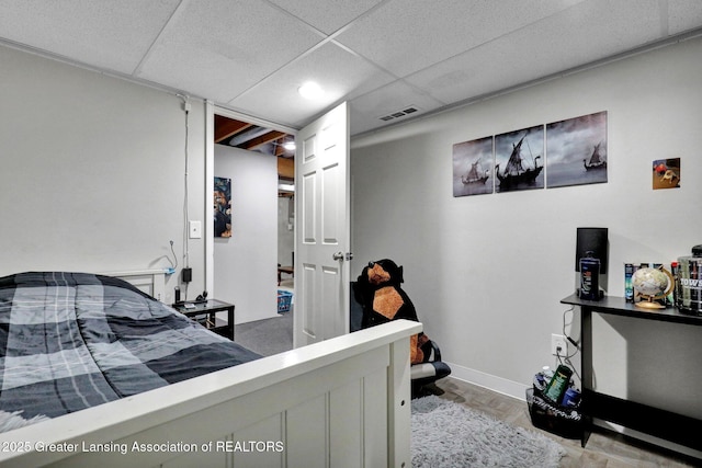 910 Pecos Dr, Lansing, MI 48917 - bedroom with baseboards and a drop ceiling