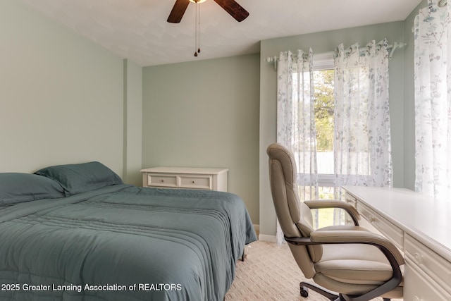 bedroom featuring carpet flooring, a ceiling fan, and baseboards