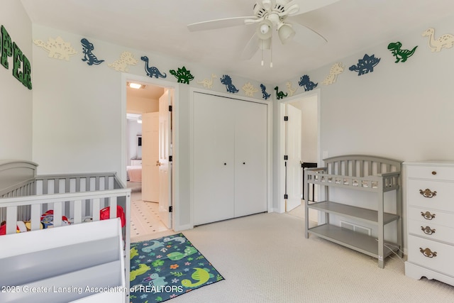 carpeted bedroom with a closet