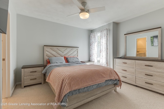 bedroom featuring light carpet and ceiling fan