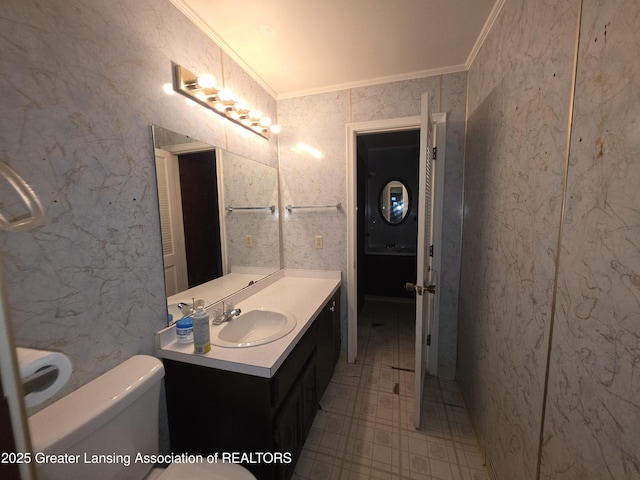526 Fenton St, Lansing, MI 48910 - bathroom with crown molding, toilet, and vanity