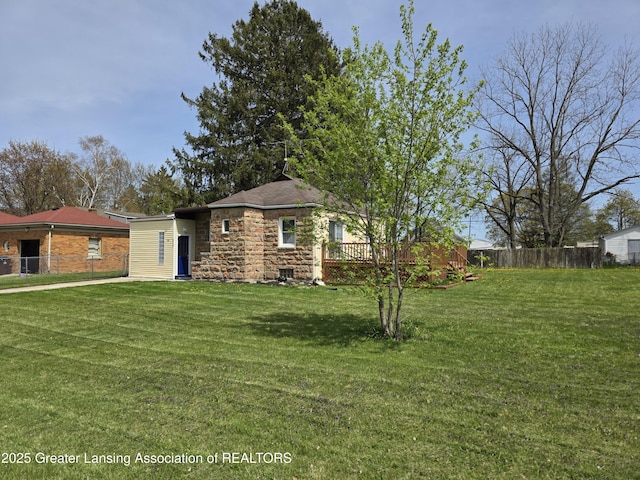 view of front of property featuring a wooden deck and stone siding