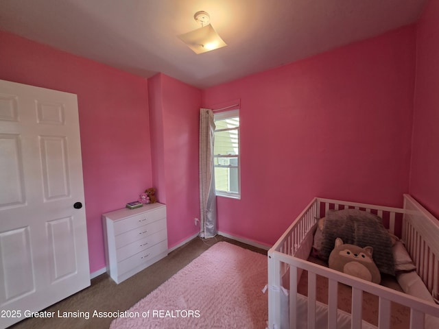 bedroom featuring carpet floors and baseboards