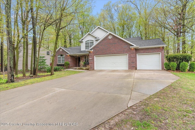 traditional home featuring brick siding, an attached garage, driveway, and roof with shingles