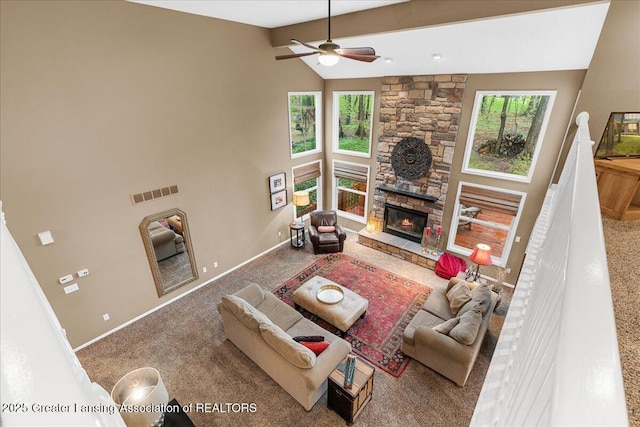 living area with a ceiling fan, baseboards, carpet, high vaulted ceiling, and beamed ceiling