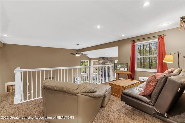 carpeted living area featuring ceiling fan, recessed lighting, and vaulted ceiling