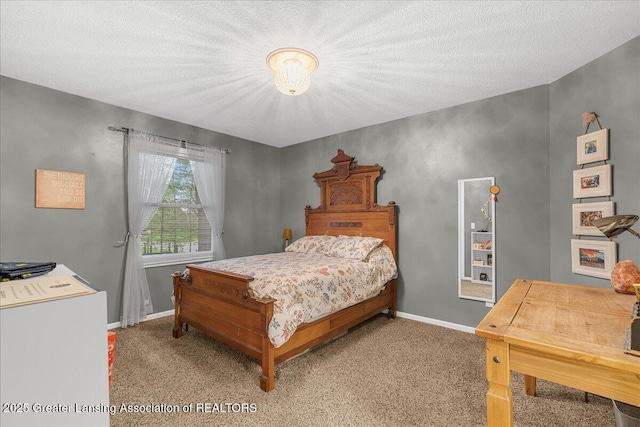 bedroom featuring baseboards, carpet flooring, and a textured ceiling