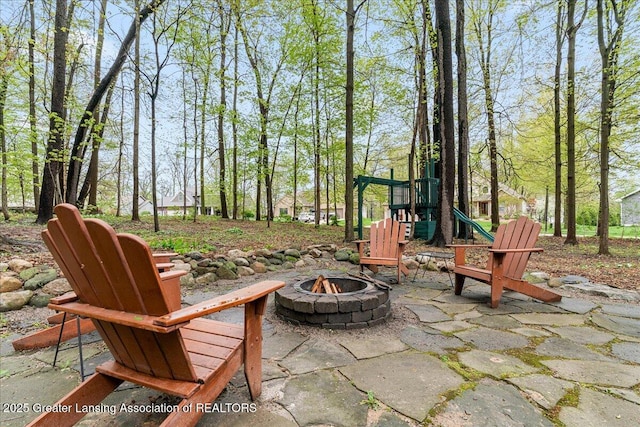 view of patio / terrace featuring a fire pit