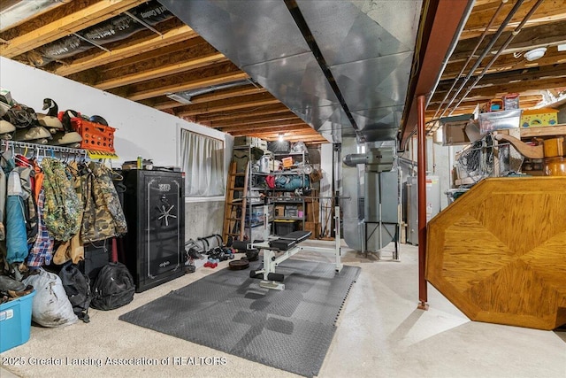 unfinished basement with gas water heater and heating unit