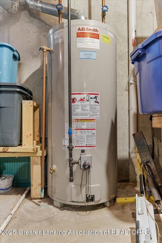 utility room featuring gas water heater