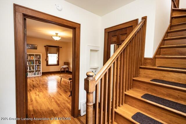 stairs with wood finished floors
