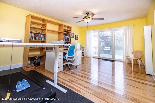 office with wood finished floors and ceiling fan