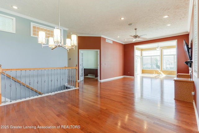 unfurnished living room featuring ornamental molding, a ceiling fan, wood finished floors, baseboards, and recessed lighting