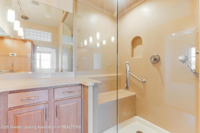 full bathroom featuring walk in shower and vanity