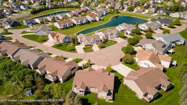 view of property location featuring a nearby body of water and nearby suburban area