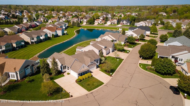 aerial view of residential area with a large body of water