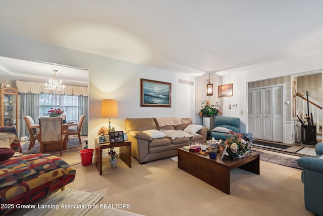 living room with a chandelier and carpet floors