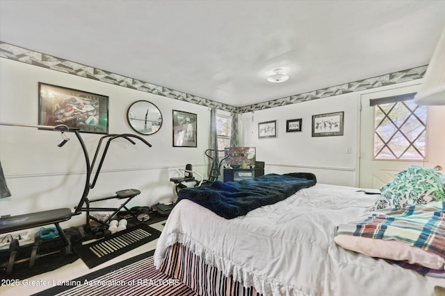 carpeted bedroom with multiple windows