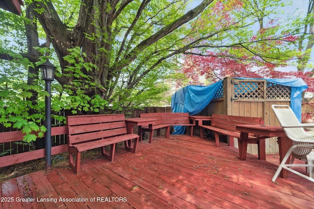 wooden deck with outdoor dining space