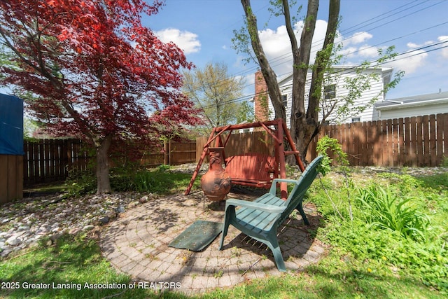 fenced backyard featuring a patio area