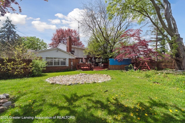 view of yard with a wooden deck