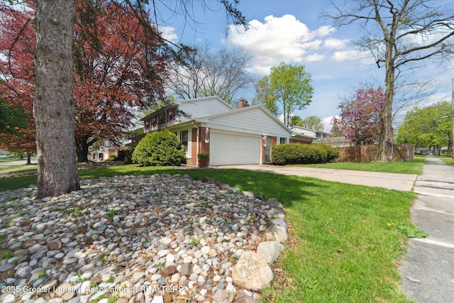 view of front of property featuring brick siding, a garage, concrete driveway, and a chimney