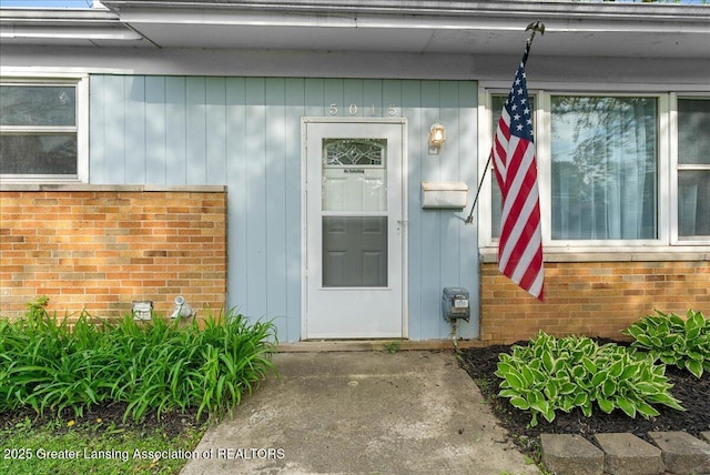 property entrance with brick siding