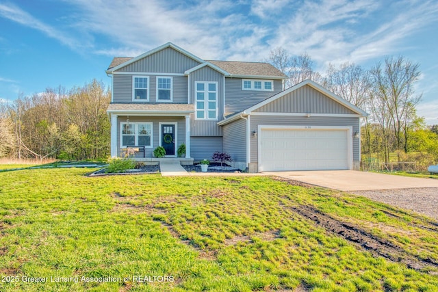traditional-style house with concrete driveway, a garage, a front lawn, and board and batten siding