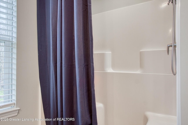 bathroom with a shower with shower curtain