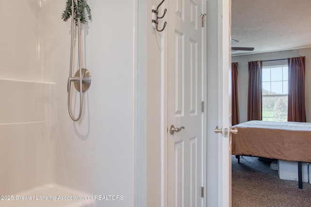 full bathroom with a shower and a textured ceiling
