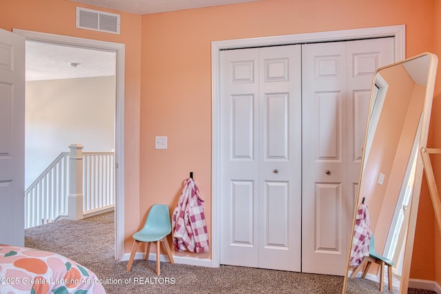 bedroom with carpet flooring and a closet