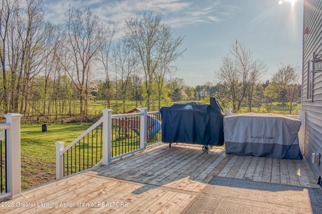 wooden terrace with a yard