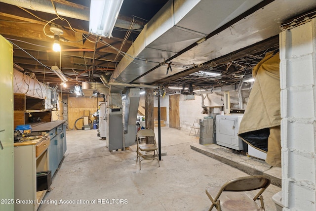 933 W Northrup St, Lansing, MI 48911 - unfinished below grade area with heating unit and independent washer and dryer