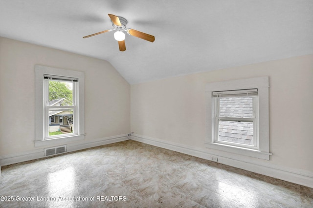 additional living space featuring vaulted ceiling, ceiling fan, and baseboards