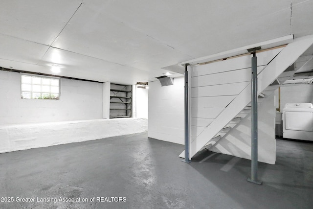 below grade area with washer / clothes dryer and stairs
