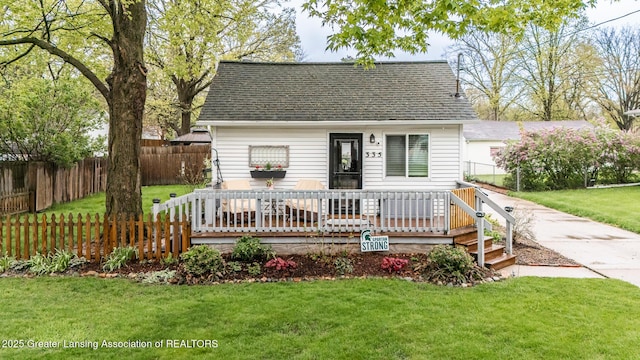 cape cod-style house featuring roof with shingles
