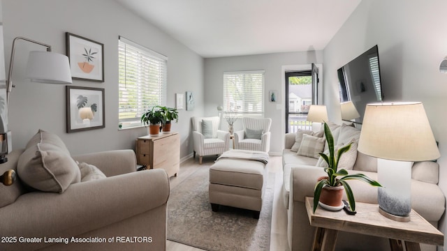 living room featuring wood finished floors and baseboards