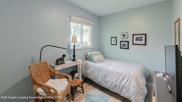 bedroom featuring wood finished floors