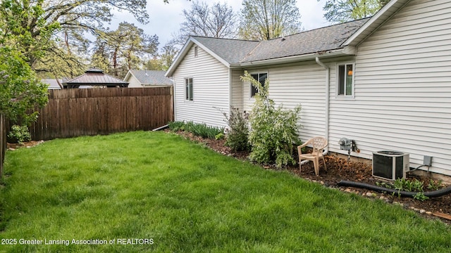 view of yard with central AC
