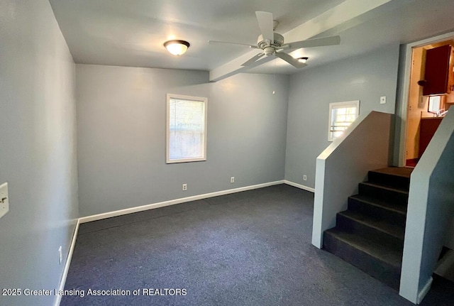 stairs with ceiling fan, baseboards, and carpet