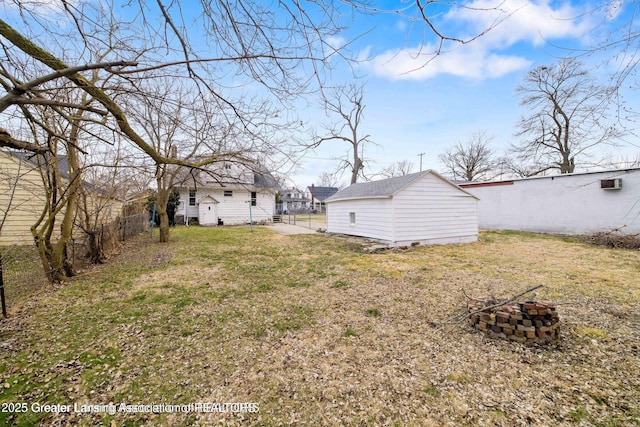 1416 Vermont Ave, Lansing, MI 48906 - view of yard featuring an outdoor structure and a fire pit