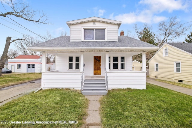 1416 Vermont Ave, Lansing, MI 48906 - bungalow-style house featuring covered porch, roof with shingles, and a front lawn