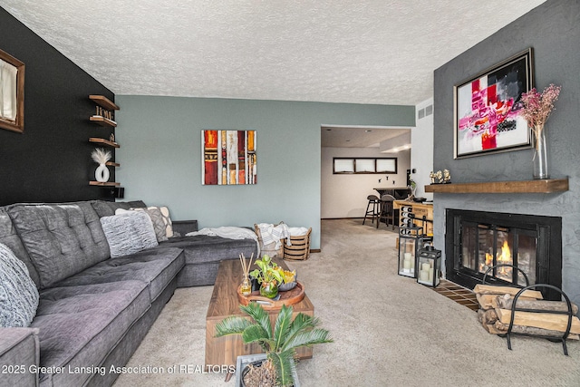5431 Wild Oak Dr, East Lansing, MI 48823 - living area with carpet flooring, a fireplace with flush hearth, and a textured ceiling