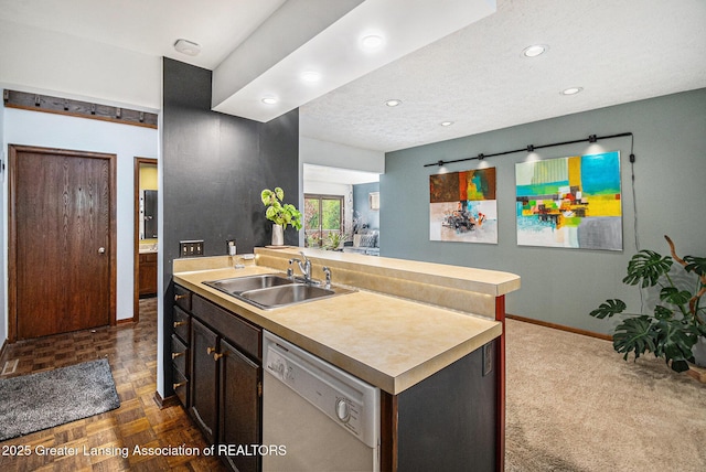 5431 Wild Oak Dr, East Lansing, MI 48823 - kitchen with a sink, dishwasher, baseboards, light countertops, and recessed lighting